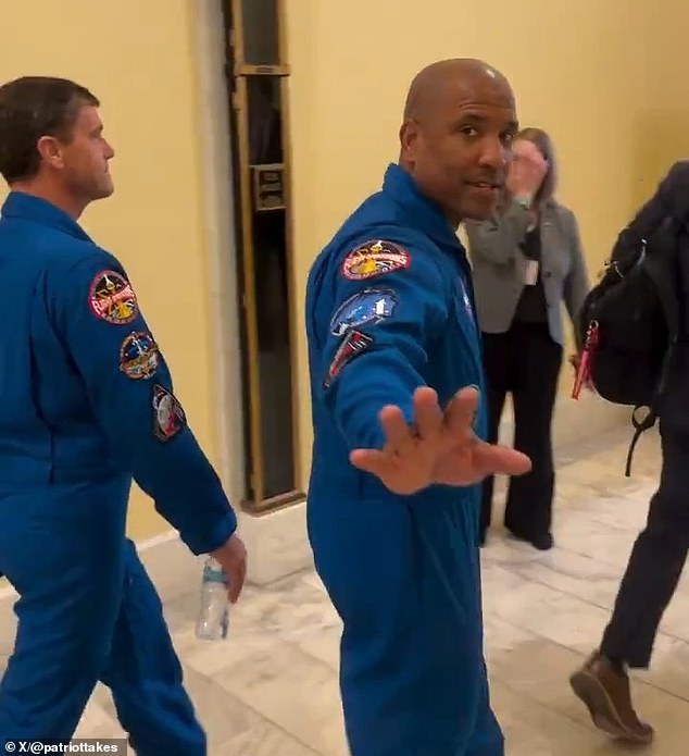 Conspiracy theorist confronts Artemis II astronauts on Capitol Hill.